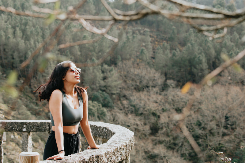 picture of a woman smiling and taking in the view outdoors